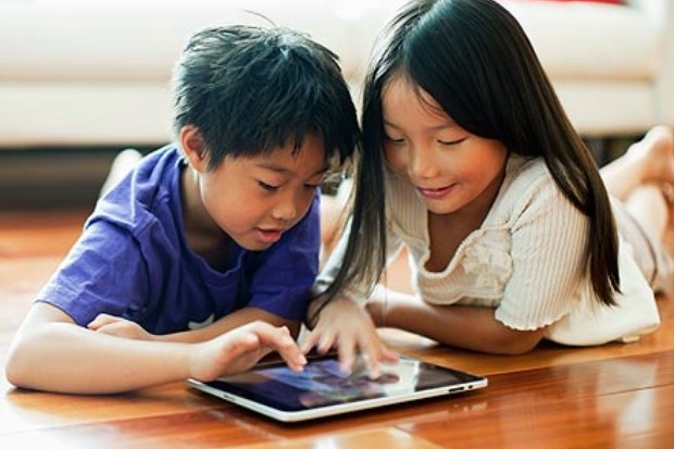 Kids playing with a tablet