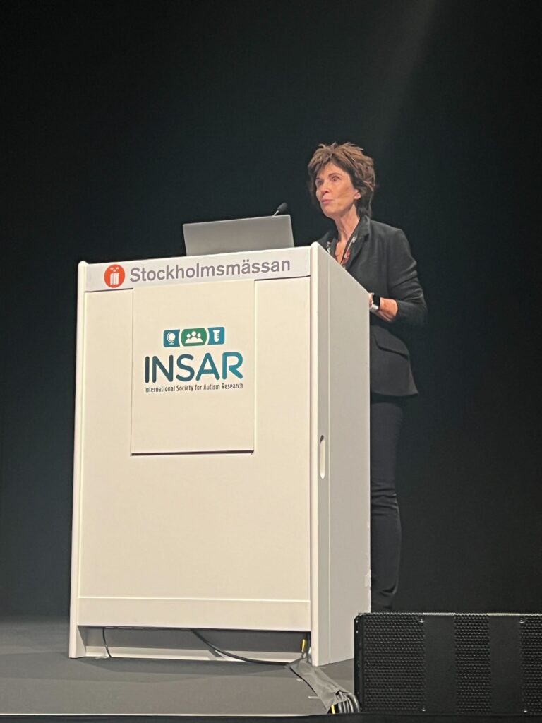 INSAR President Connie Kasari speaking at INSAR 2023